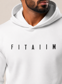 A close-up of a man wearing a white pullover hoodie with the name 'FITAIIM' printed in black capital letters across the chest.